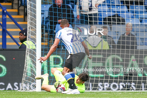 James Beadle of Sheffield Wednesday intercepts the cross at the feet of #20, Uros Racic of WBA during the Sky Bet Championship match between...