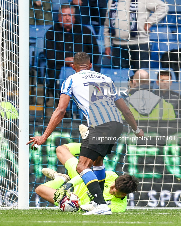 James Beadle of Sheffield Wednesday intercepts the cross at the feet of #20, Uros Racic of WBA during the Sky Bet Championship match between...