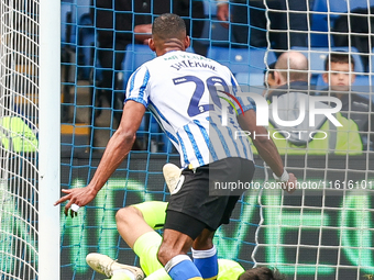 James Beadle of Sheffield Wednesday intercepts the cross at the feet of #20, Uros Racic of WBA during the Sky Bet Championship match between...