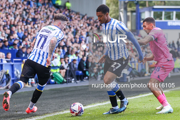 #27, Yan Valery of Sheffield Wednesday, in attacking action pressed by #18, Karlan Grant of WBA during the Sky Bet Championship match betwee...