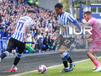 #27, Yan Valery of Sheffield Wednesday, in attacking action pressed by #18, Karlan Grant of WBA during the Sky Bet Championship match betwee...