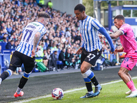 #27, Yan Valery of Sheffield Wednesday, in attacking action pressed by #18, Karlan Grant of WBA during the Sky Bet Championship match betwee...