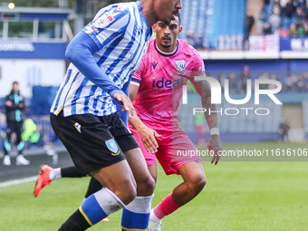 #27, Yan Valery of Sheffield Wednesday, in attacking action pressed by #18, Karlan Grant of WBA during the Sky Bet Championship match betwee...