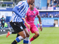 #27, Yan Valery of Sheffield Wednesday, in attacking action pressed by #18, Karlan Grant of WBA during the Sky Bet Championship match betwee...