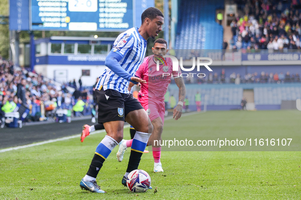 #27, Yan Valery of Sheffield Wednesday, in attacking action pressed by #18, Karlan Grant of WBA during the Sky Bet Championship match betwee...