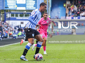 #27, Yan Valery of Sheffield Wednesday, in attacking action pressed by #18, Karlan Grant of WBA during the Sky Bet Championship match betwee...