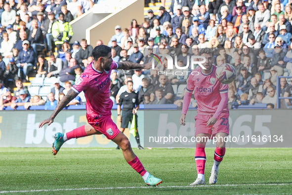 #27, Alex Mowatt of WBA lines up the volley which makes it 2-2, watched by #22, Mikey Johnston, during the Sky Bet Championship match betwee...