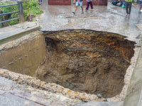 The flooding of the Nakhu River damages the road and riverbank during heavy rainfall in Lalitpur, Nepal, on September 28, 2024. Due to road...