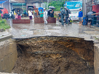 The flooding of the Nakhu River damages the road and riverbank during heavy rainfall in Lalitpur, Nepal, on September 28, 2024. Due to road...