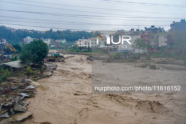 The flooding of the Nakhu River damages the road and riverbank during heavy rainfall in Lalitpur, Nepal, on September 28, 2024. Due to road...