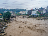 The flooding of the Nakhu River damages the road and riverbank during heavy rainfall in Lalitpur, Nepal, on September 28, 2024. Due to road...