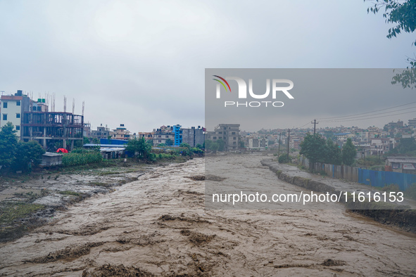 The flooding of the Nakhu River damages the road and riverbank during heavy rainfall in Lalitpur, Nepal, on September 28, 2024. Due to road...