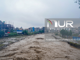 The flooding of the Nakhu River damages the road and riverbank during heavy rainfall in Lalitpur, Nepal, on September 28, 2024. Due to road...