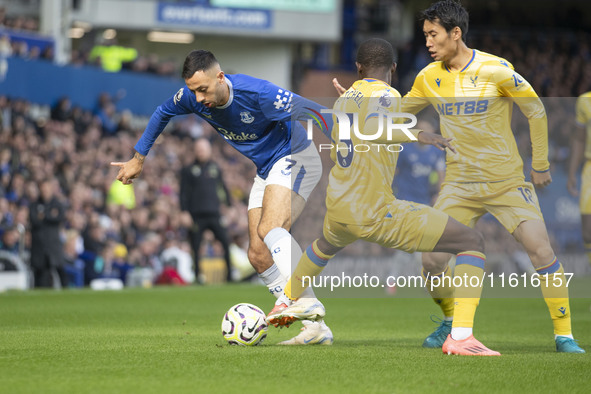 Dwight McNeil #7 of Everton F.C. is tackled by an opponent during the Premier League match between Everton and Crystal Palace at Goodison Pa...