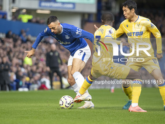 Dwight McNeil #7 of Everton F.C. is tackled by an opponent during the Premier League match between Everton and Crystal Palace at Goodison Pa...