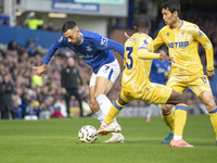 Dwight McNeil #7 of Everton F.C. is tackled by an opponent during the Premier League match between Everton and Crystal Palace at Goodison Pa...