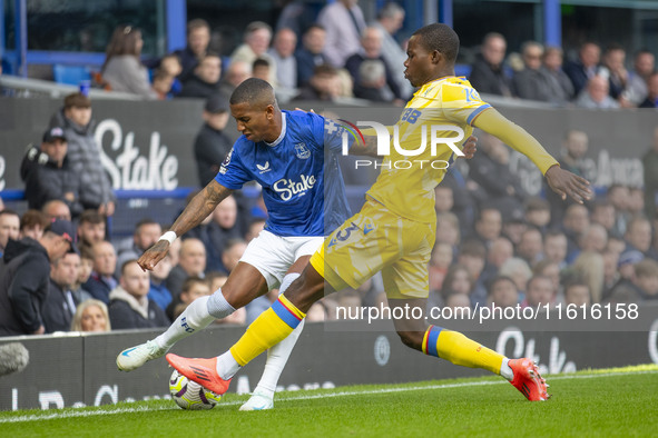 Ashley Young #18 of Everton F.C. is tackled by Tyrick Mitchell #3 of Crystal Palace F.C. during the Premier League match between Everton and...