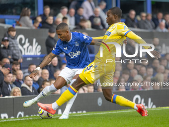 Ashley Young #18 of Everton F.C. is tackled by Tyrick Mitchell #3 of Crystal Palace F.C. during the Premier League match between Everton and...