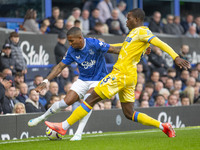 Ashley Young #18 of Everton F.C. is tackled by Tyrick Mitchell #3 of Crystal Palace F.C. during the Premier League match between Everton and...