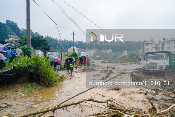 The flooding of the Nakhu River damages the road and riverbank during heavy rainfall in Lalitpur, Nepal, on September 28, 2024. Due to road...