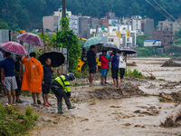 The flooding of the Nakhu River damages the road and riverbank during heavy rainfall in Lalitpur, Nepal, on September 28, 2024. Due to road...