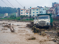 The flooding of the Nakhu River damages the road and riverbank during heavy rainfall in Lalitpur, Nepal, on September 28, 2024. Due to road...