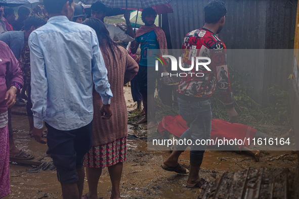 A person lives on the bank of the Nakhu River and is swept away and dies in the flood in Lalitpur, Nepal, on September 28, 2024. 