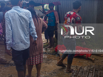 A person lives on the bank of the Nakhu River and is swept away and dies in the flood in Lalitpur, Nepal, on September 28, 2024. (