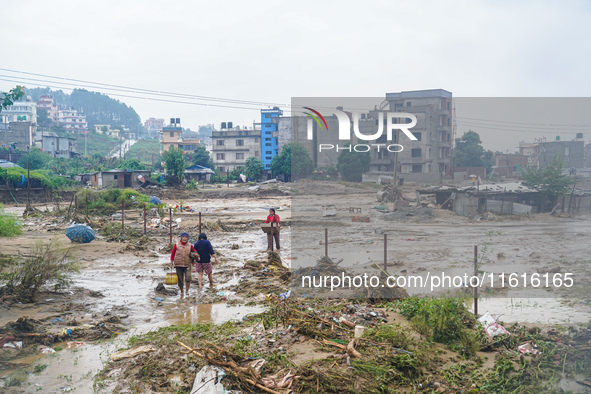 People's daily lives are affected due to heavy rainfall and flooding of the Nakhu River in Kathmandu, Nepal, on September 27, 2024. 