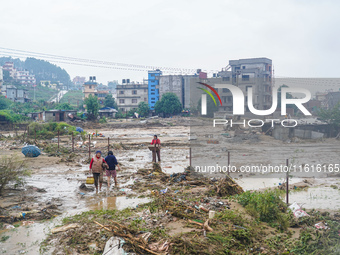 People's daily lives are affected due to heavy rainfall and flooding of the Nakhu River in Kathmandu, Nepal, on September 27, 2024. (