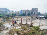 People's daily lives are affected due to heavy rainfall and flooding of the Nakhu River in Kathmandu, Nepal, on September 27, 2024. (