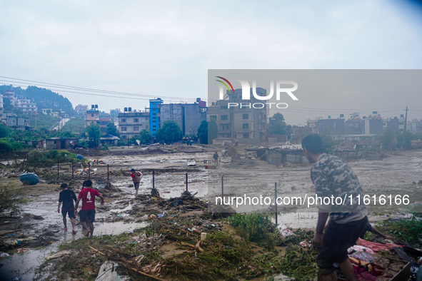 People's daily lives are affected due to heavy rainfall and flooding of the Nakhu River in Kathmandu, Nepal, on September 27, 2024. 