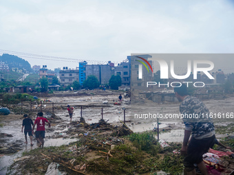 People's daily lives are affected due to heavy rainfall and flooding of the Nakhu River in Kathmandu, Nepal, on September 27, 2024. (