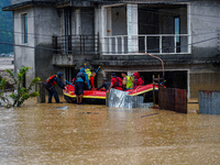 The rescue team rescues those trapped in the Nakhu River flood in Lalitpur, Nepal, on September 28, 2024. (