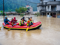 The rescue team rescues those trapped in the Nakhu River flood in Lalitpur, Nepal, on September 28, 2024. (