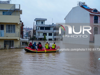 The rescue team rescues those trapped in the Nakhu River flood in Lalitpur, Nepal, on September 28, 2024. (