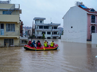 The rescue team rescues those trapped in the Nakhu River flood in Lalitpur, Nepal, on September 28, 2024. (