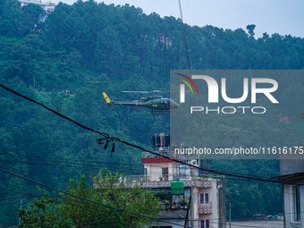 The rescue team of the Nepal Army rescues those trapped in the Nakhu River flood in Lalitpur, Nepal, on September 28, 2024, by helicopter. (