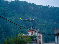 The rescue team of the Nepal Army rescues those trapped in the Nakhu River flood in Lalitpur, Nepal, on September 28, 2024, by helicopter. (