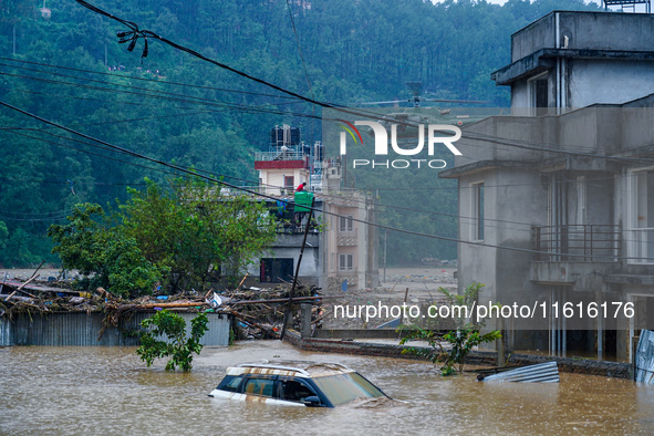 The rescue team of the Nepal Army rescues those trapped in the Nakhu River flood in Lalitpur, Nepal, on September 28, 2024, by helicopter. 