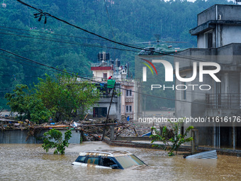 The rescue team of the Nepal Army rescues those trapped in the Nakhu River flood in Lalitpur, Nepal, on September 28, 2024, by helicopter. (