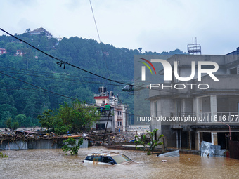 The rescue team of the Nepal Army rescues those trapped in the Nakhu River flood in Lalitpur, Nepal, on September 28, 2024, by helicopter. (