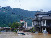 The rescue team of the Nepal Army rescues those trapped in the Nakhu River flood in Lalitpur, Nepal, on September 28, 2024, by helicopter. (