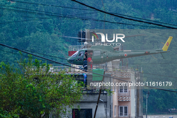 The rescue team of the Nepal Army rescues those trapped in the Nakhu River flood in Lalitpur, Nepal, on September 28, 2024, by helicopter. 