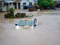 Vehicles are submerged in the flooding of the Nakhu River in Lalitpur, Nepal, on September 28, 2024. (