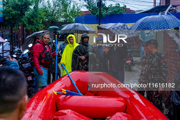 The rescue team of the Nepali Army rescues those trapped in the Nakhu River flood in Lalitpur, Nepal, on September 28, 2024. 