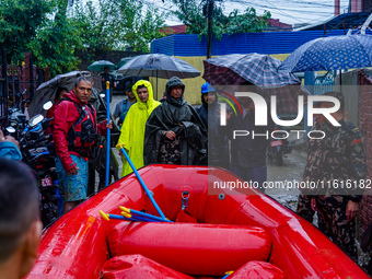 The rescue team of the Nepali Army rescues those trapped in the Nakhu River flood in Lalitpur, Nepal, on September 28, 2024. (