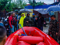 The rescue team of the Nepali Army rescues those trapped in the Nakhu River flood in Lalitpur, Nepal, on September 28, 2024. (