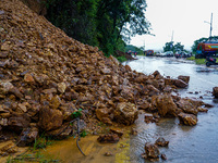 The Nakhu River floods and affects the riverbanks and homes during heavy rainfall in Kathmandu, Nepal, on September 28, 2024. (