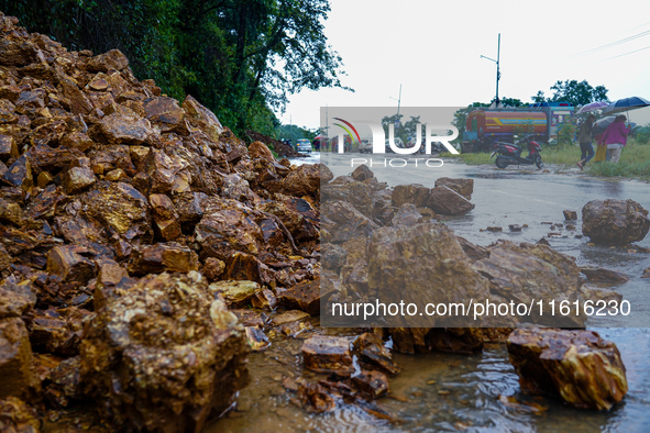 The Nakhu River floods and affects the riverbanks and homes during heavy rainfall in Kathmandu, Nepal, on September 28, 2024. 